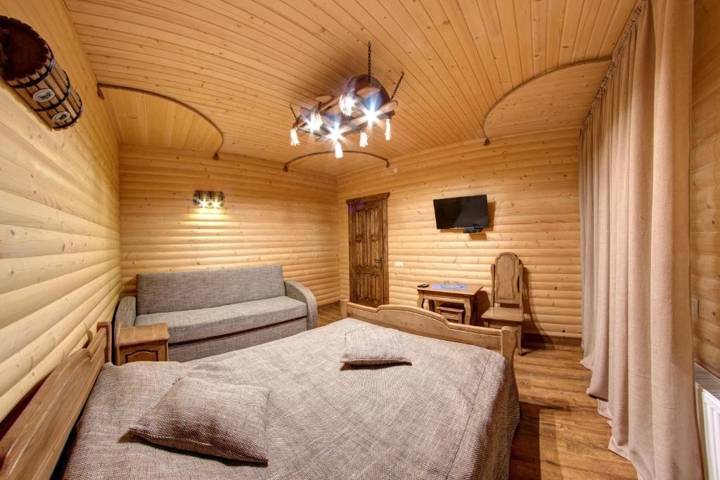Postel nebo postele na pokoji v ubytování Lavina Hotel