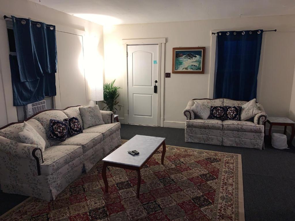 a living room with a couch and a coffee table at 3 bedroom one bathroom townhouse - 20B Elm street Charlton Heights WV 25040 in Glen Ferris