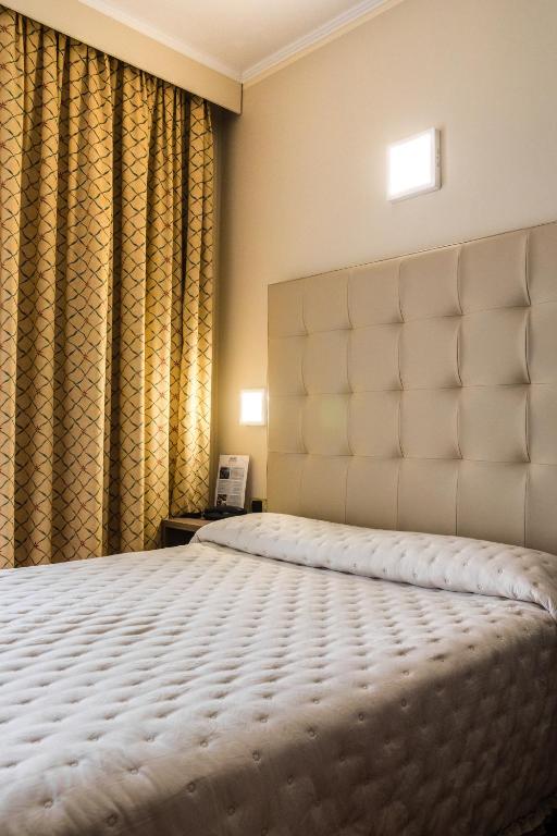 Кровать или кровати в номере Grande Albergo