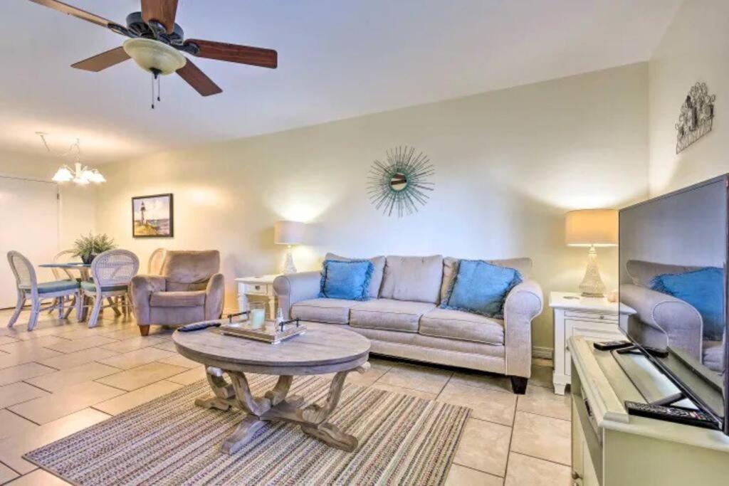 a living room with a couch and a table at Resort gem w/ 2-bedrooms and easy walk to beach in Panama City Beach