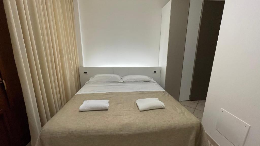 Postel nebo postele na pokoji v ubytování Hotel Boschetto