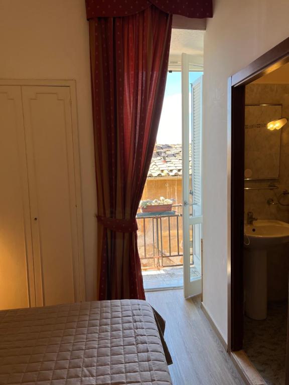 Posteľ alebo postele v izbe v ubytovaní Hotel Umbria