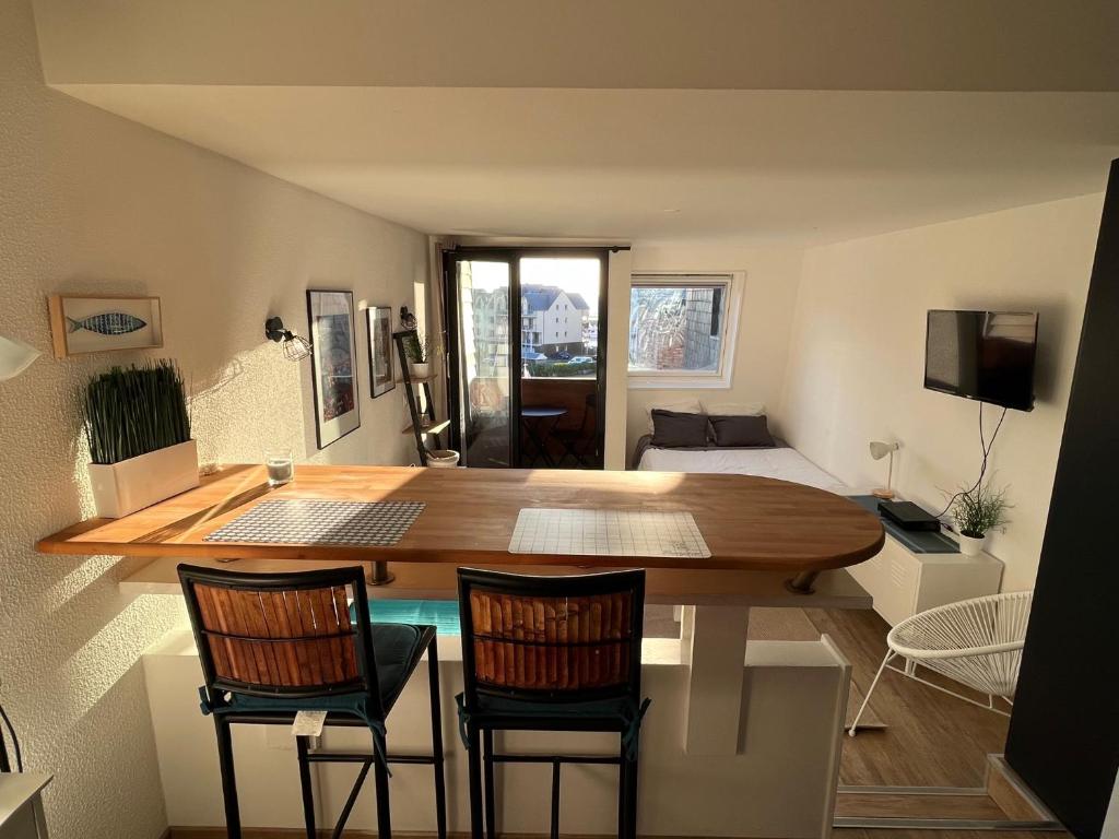 Телевизор и/или развлекательный центр в Appartement La Marina Deauville