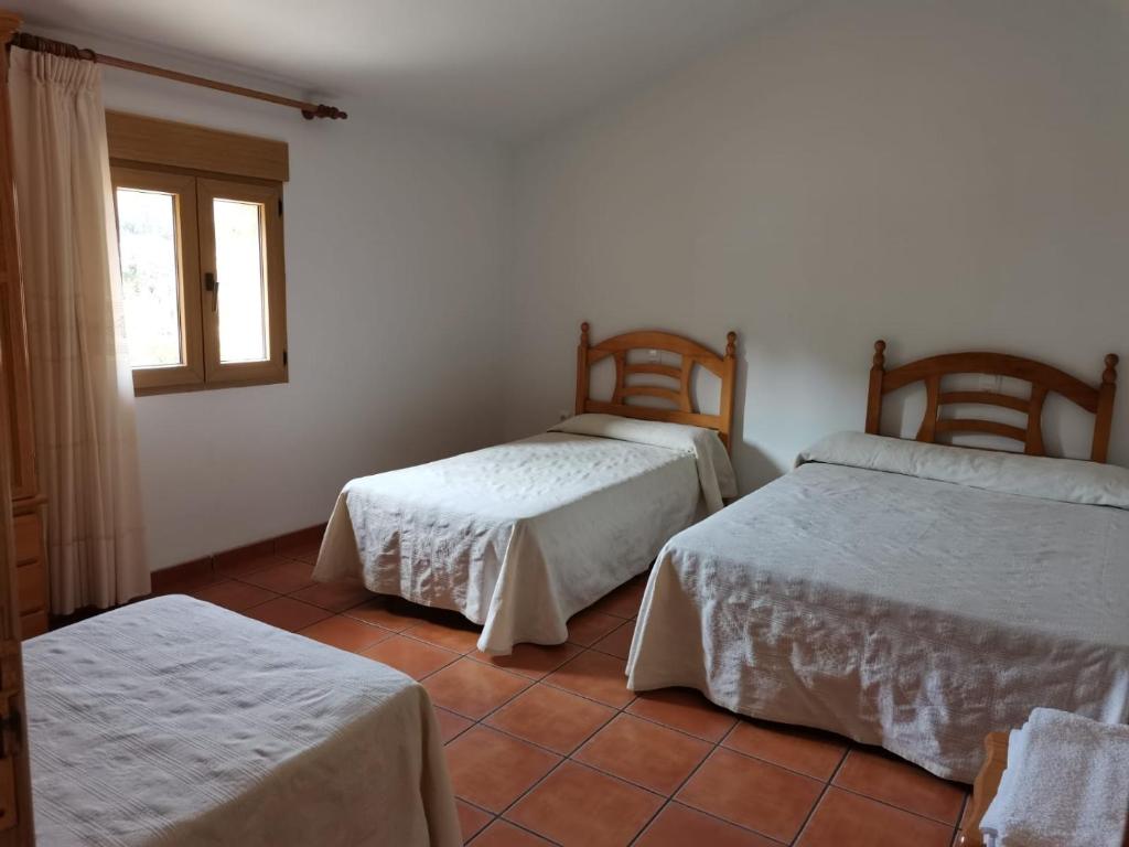 Säng eller sängar i ett rum på Masia Campos Culla