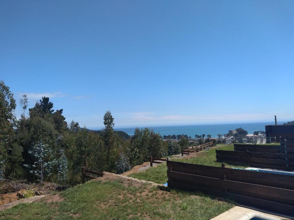 a view of the ocean from the top of a hill at Casa Pingueral Tomé in Concepción