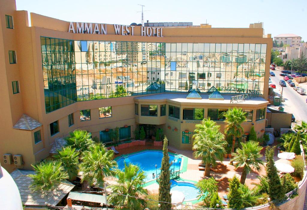 an aerial view of a hotel with a swimming pool at Amman West Hotel in Amman
