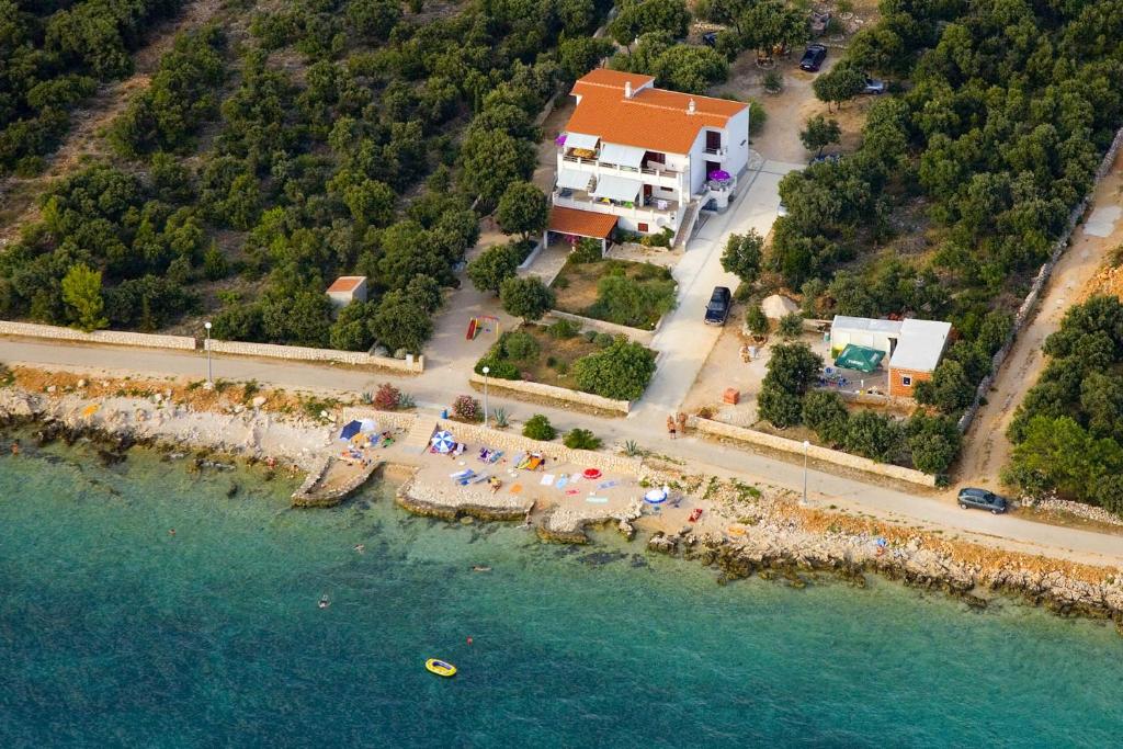 an aerial view of a beach with a resort at Apartments by the sea Mandre, Pag - 6284 in Kolan