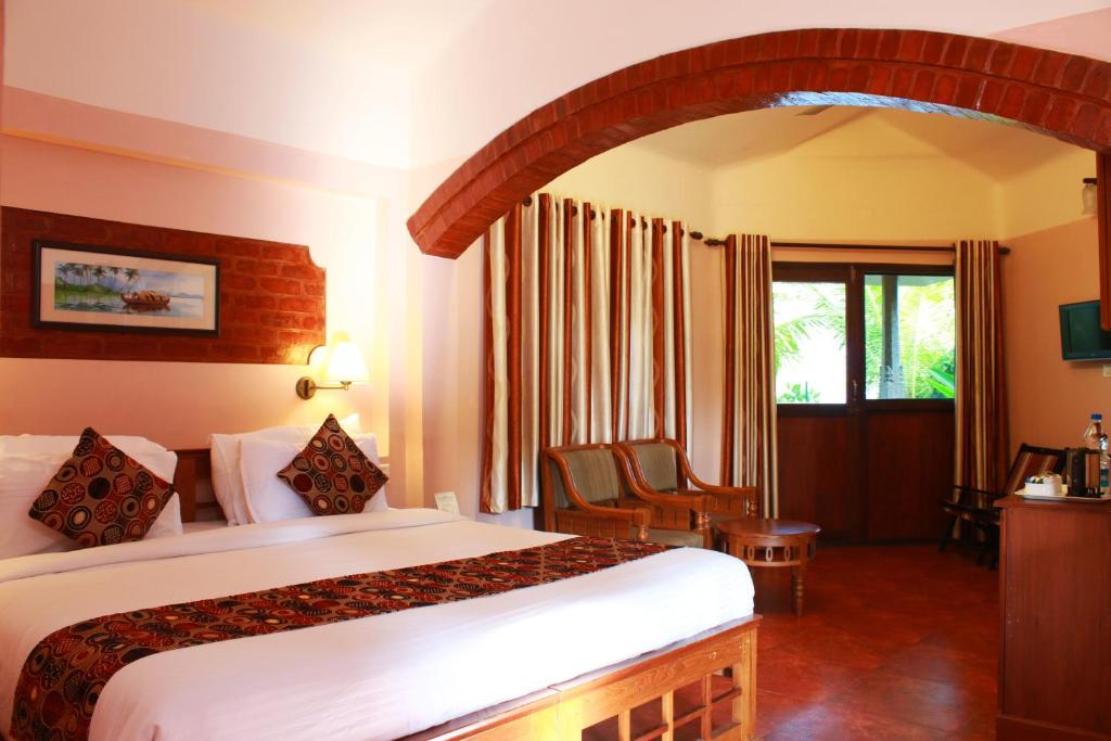 Postel nebo postele na pokoji v ubytování Cherai Beach Resorts