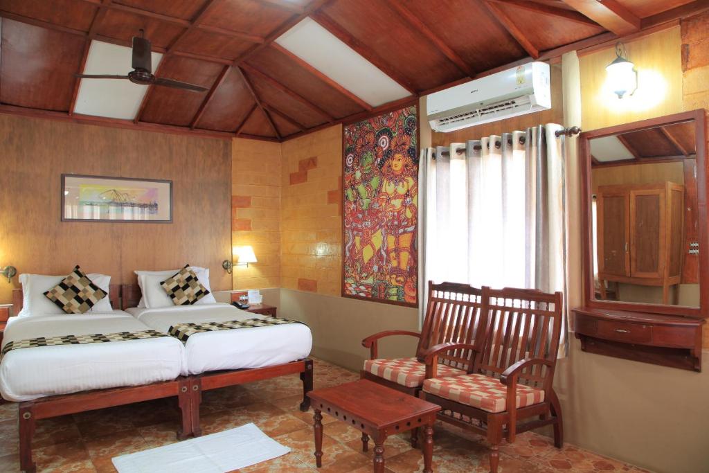 Postel nebo postele na pokoji v ubytování Cherai Beach Resorts