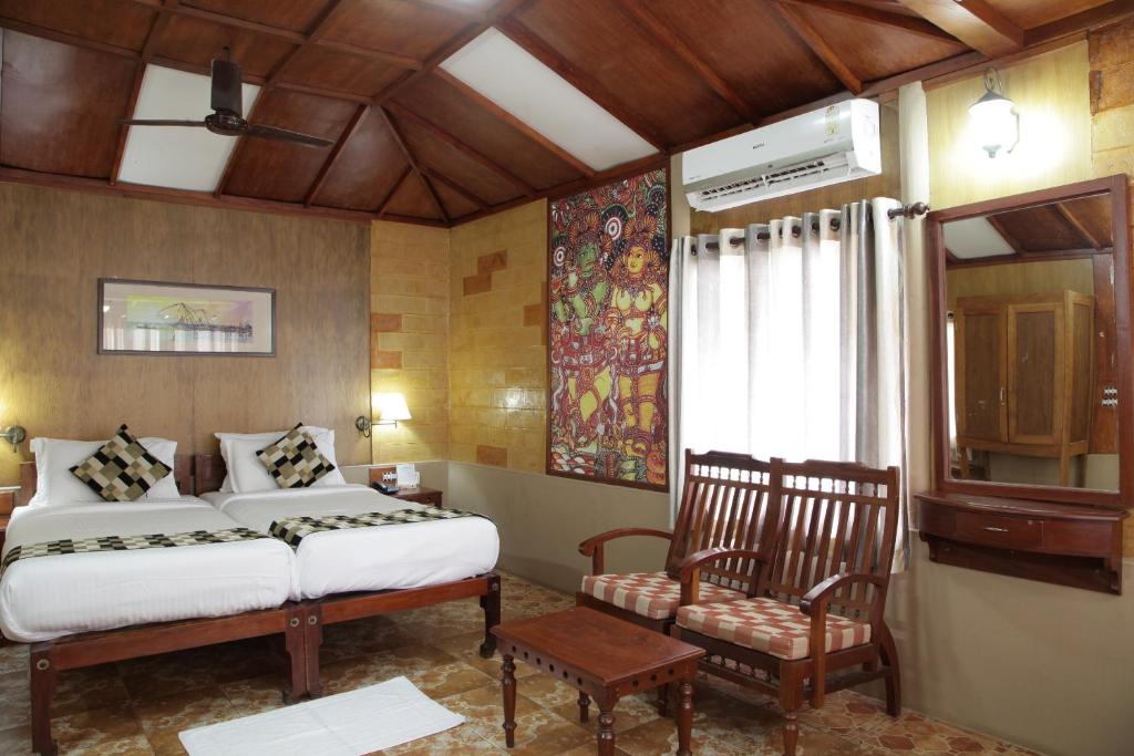 Postel nebo postele na pokoji v ubytování Cherai Beach Resorts