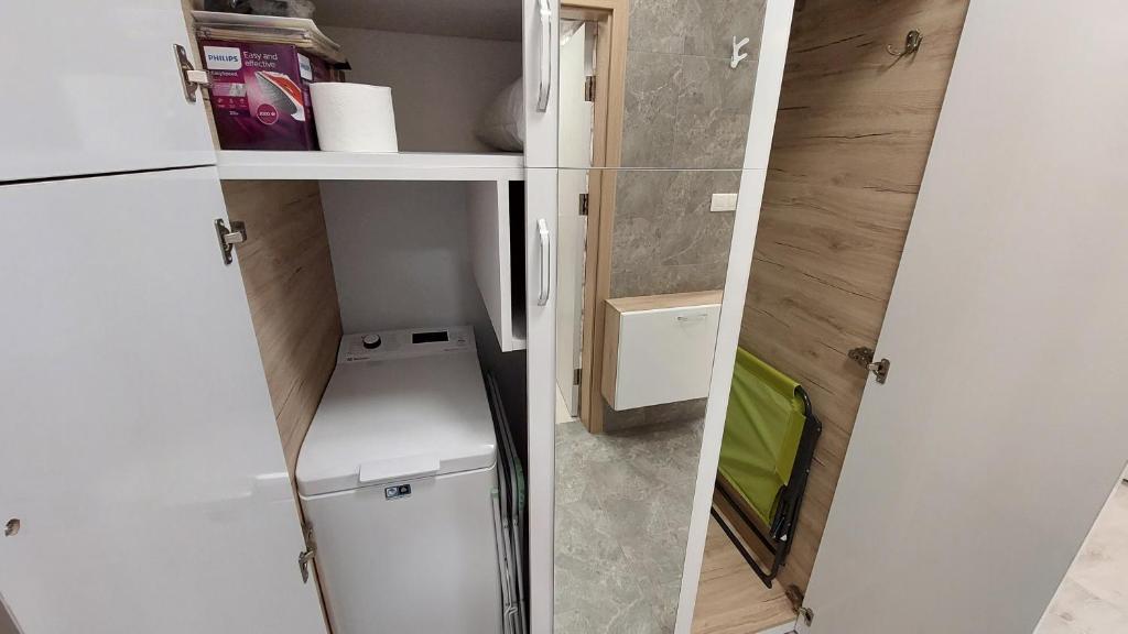 A kitchen or kitchenette at Sunrise City A1, Sarafovo