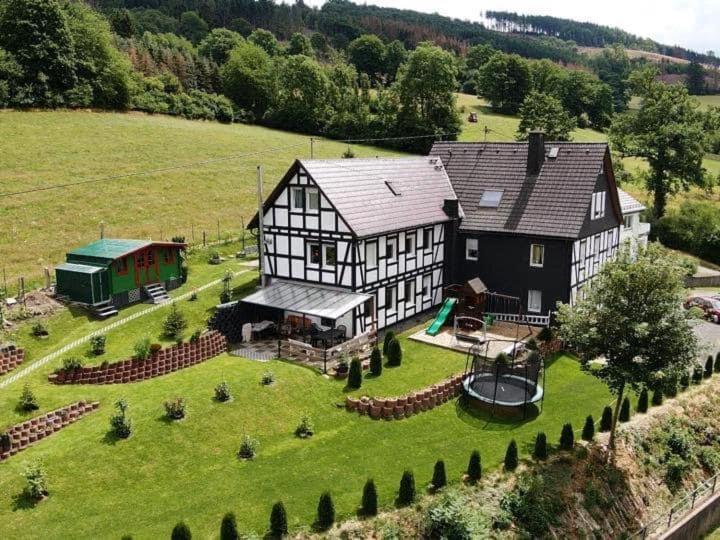 an aerial view of a large house with a playground at Freizeithaus Maranatha in Kirchhundem