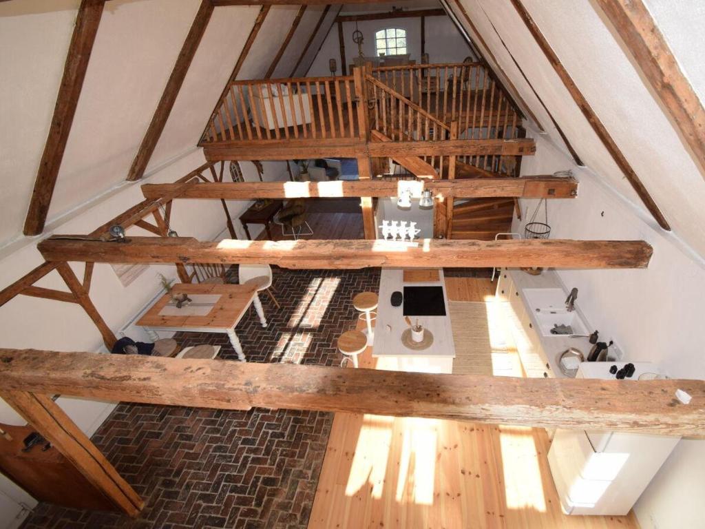 an overhead view of an attic with wooden beams at Ferienhaus Galerie No 5 in Garding