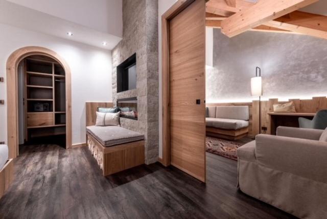 Postel nebo postele na pokoji v ubytování Renè Dolomites Boutique Hotel