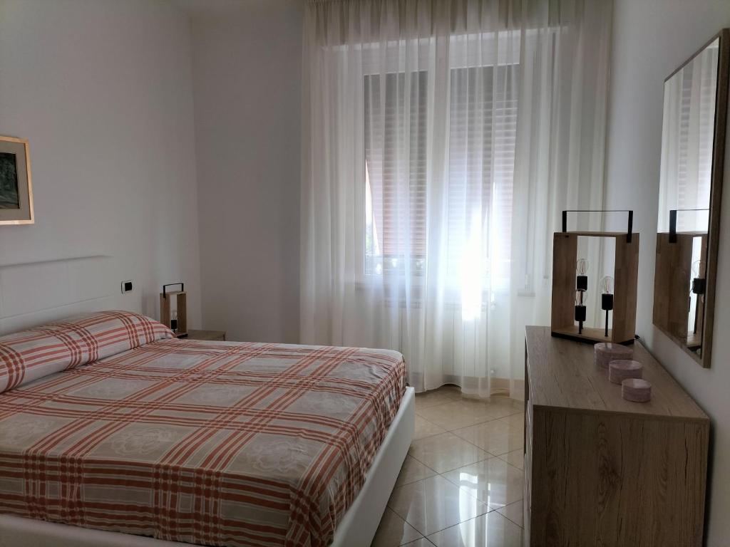 Ένα ή περισσότερα κρεβάτια σε δωμάτιο στο Casa di Gabry
