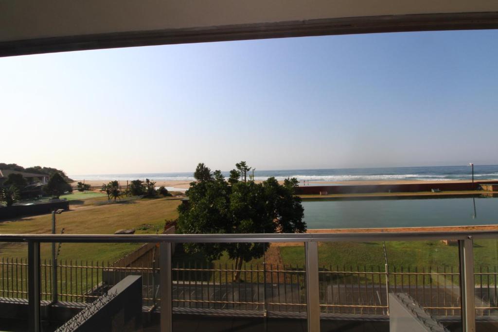 a view of the beach from the balcony of a house at Boulevard 105 in Margate