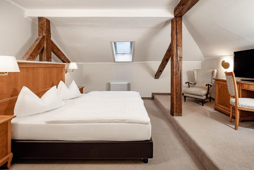 Postel nebo postele na pokoji v ubytování Classic Hotel Meranerhof