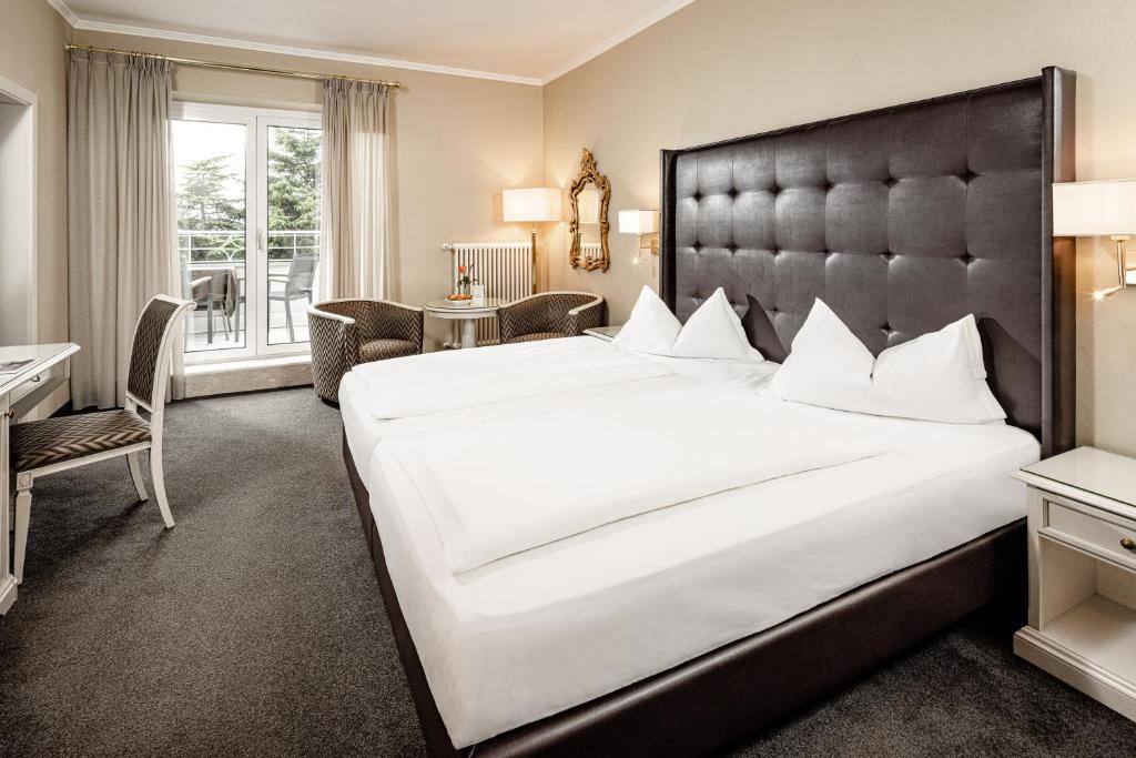 Postel nebo postele na pokoji v ubytování Classic Hotel Meranerhof
