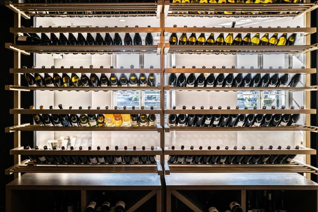 a wall of wine bottles in a wine cellar at Fleur de Loire in Blois