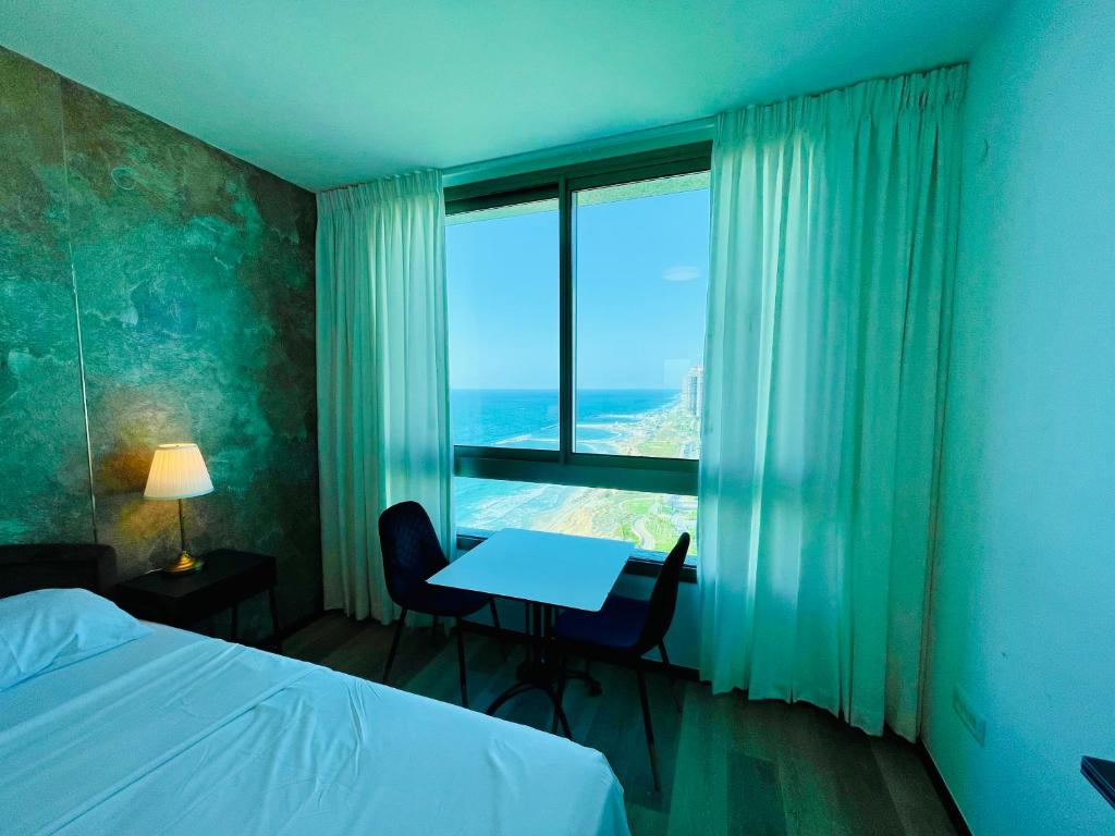 Postel nebo postele na pokoji v ubytování Carmel Holiday Apartments