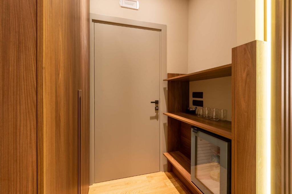 a door that is in a room with a fireplace at ELICAL Exclusive Private Suites in Rome