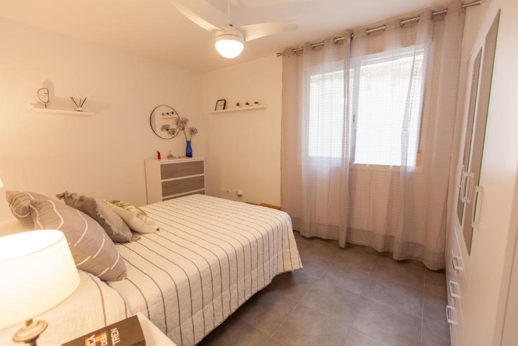 Postel nebo postele na pokoji v ubytování La playa a tu alcance