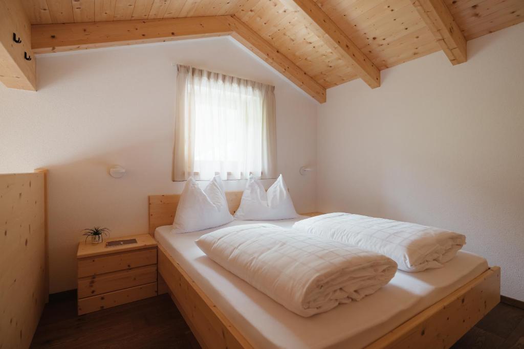 Postel nebo postele na pokoji v ubytování Untermairhof Appartment Residence