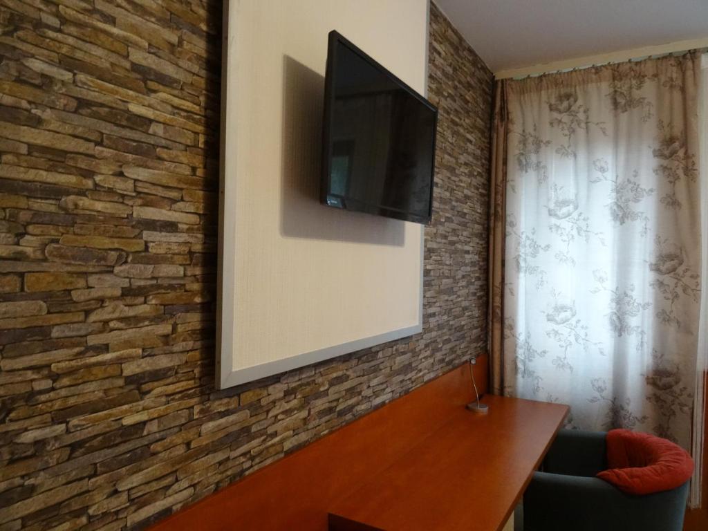 TV a/nebo společenská místnost v ubytování Fortuna Hotel