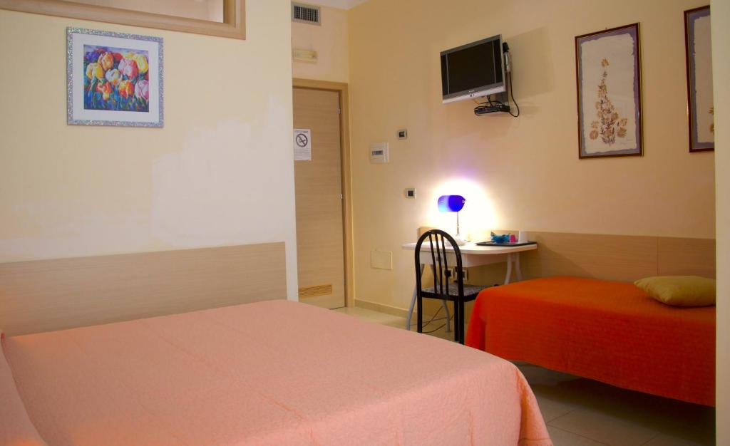 Postel nebo postele na pokoji v ubytování b&b il villino