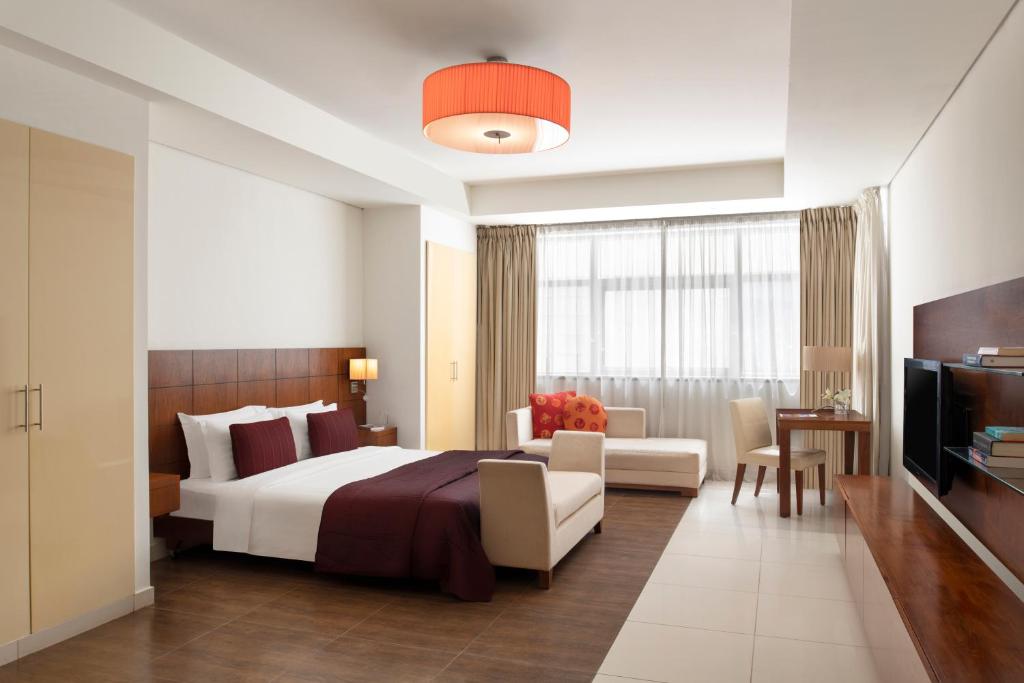 Ένα ή περισσότερα κρεβάτια σε δωμάτιο στο Fraser Suites Doha