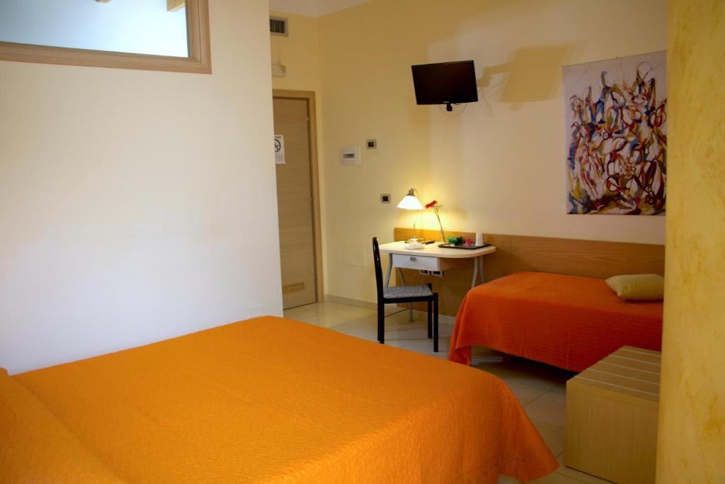 Postel nebo postele na pokoji v ubytování b&b il villino