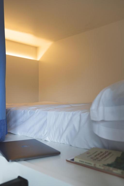 Postel nebo postele na pokoji v ubytování Hostel Villa Miguela