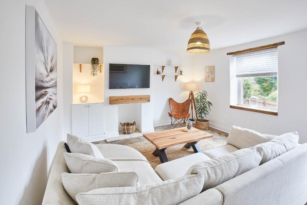 a living room with a couch and a table at Host & Stay - Tally House in West Rainton