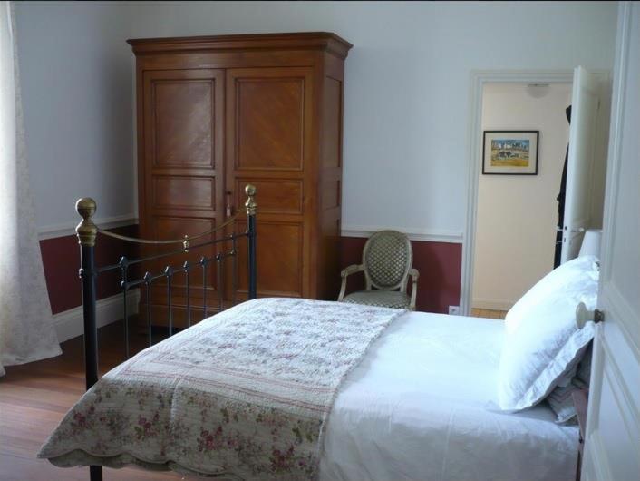 Postel nebo postele na pokoji v ubytování L'orée du lac - Formule Chambres