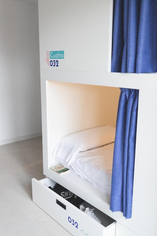 Postel nebo postele na pokoji v ubytování Hostel Villa Miguela