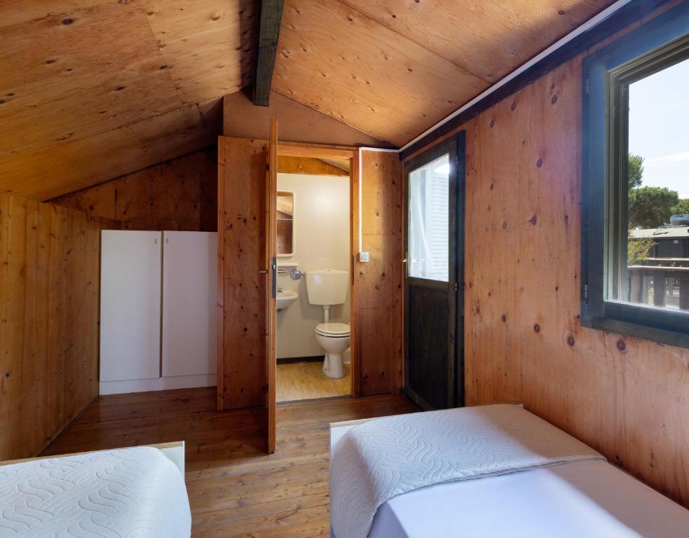 Postel nebo postele na pokoji v ubytování Residence Mare Pineta