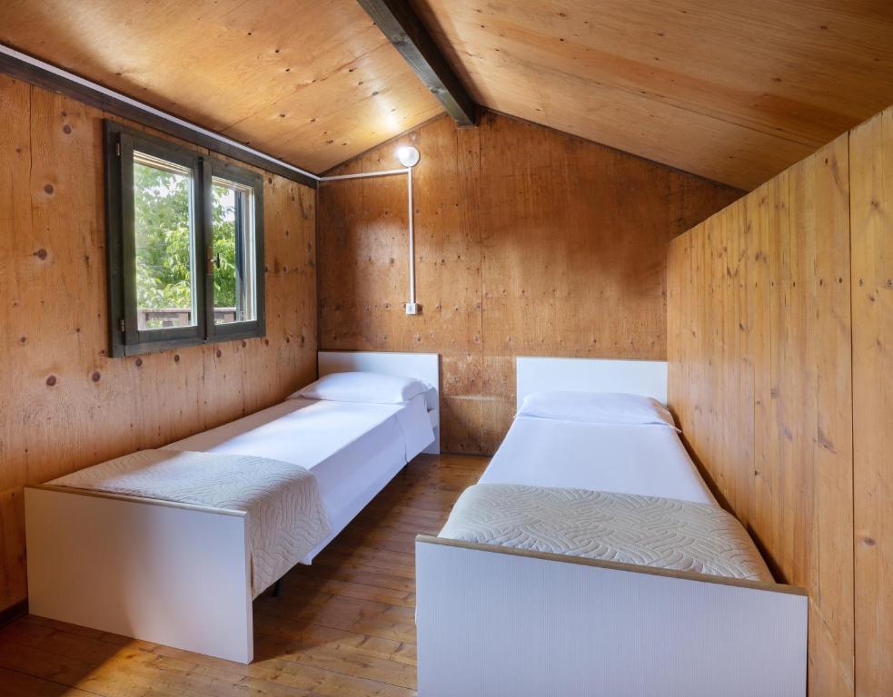 Postel nebo postele na pokoji v ubytování Residence Mare Pineta