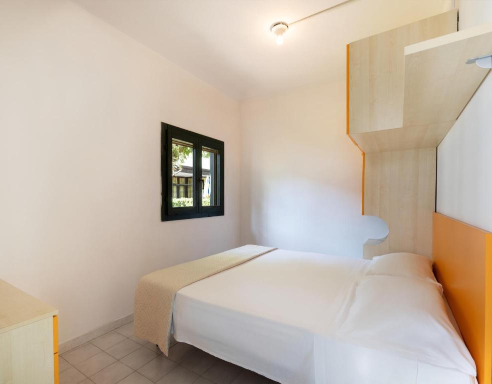 Postel nebo postele na pokoji v ubytování Residence Mare Pineta