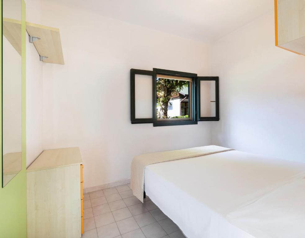 Postel nebo postele na pokoji v ubytování Residence Mare Pineta