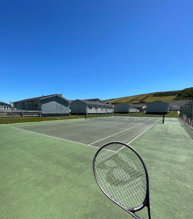 a tennis racket sitting on a tennis court at Croyde Bay Hotel or Self Catering in Croyde