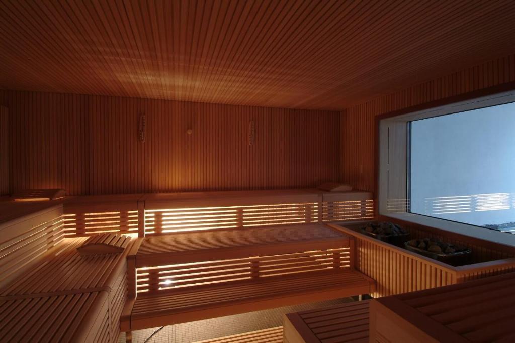 TV a/nebo společenská místnost v ubytování Hotel Schweizerhof Lenzerheide