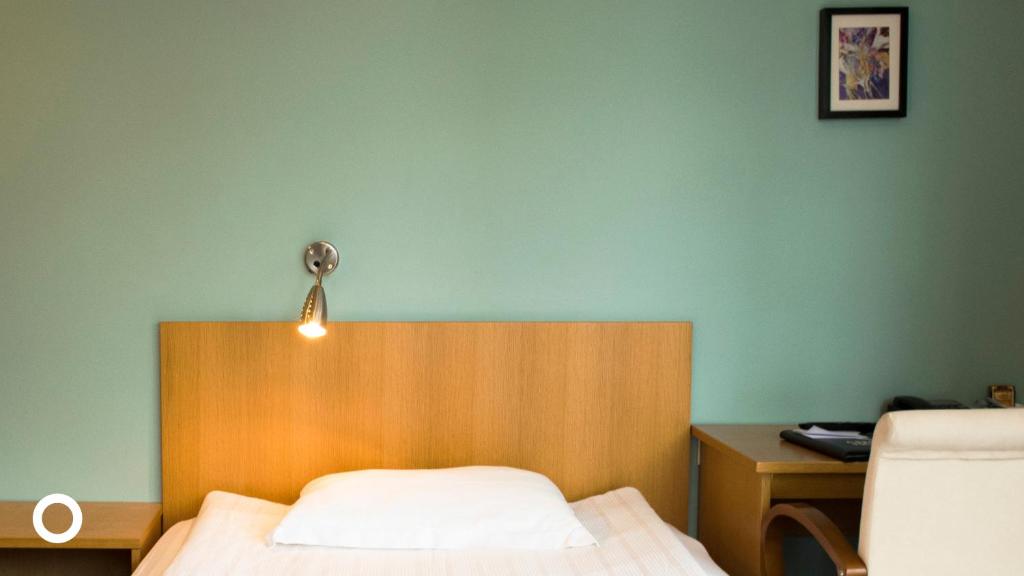 Postel nebo postele na pokoji v ubytování Center Hotels Klopp