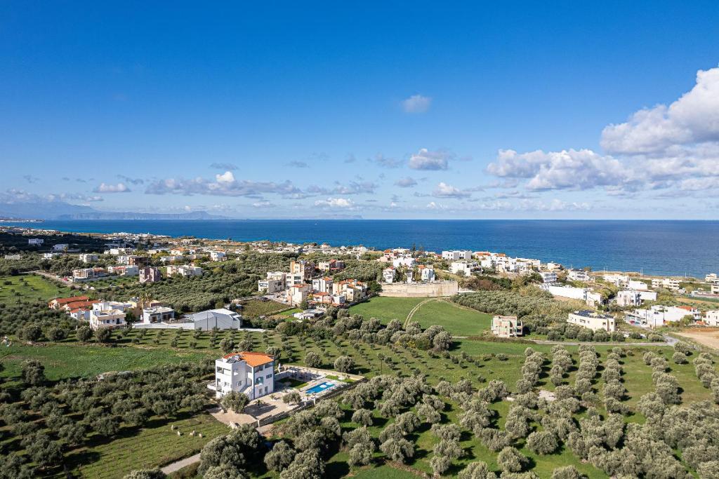 an aerial view of a city and the ocean at Vita Residence, a Charming Family Escape,By ThinkVilla in Pangalochori