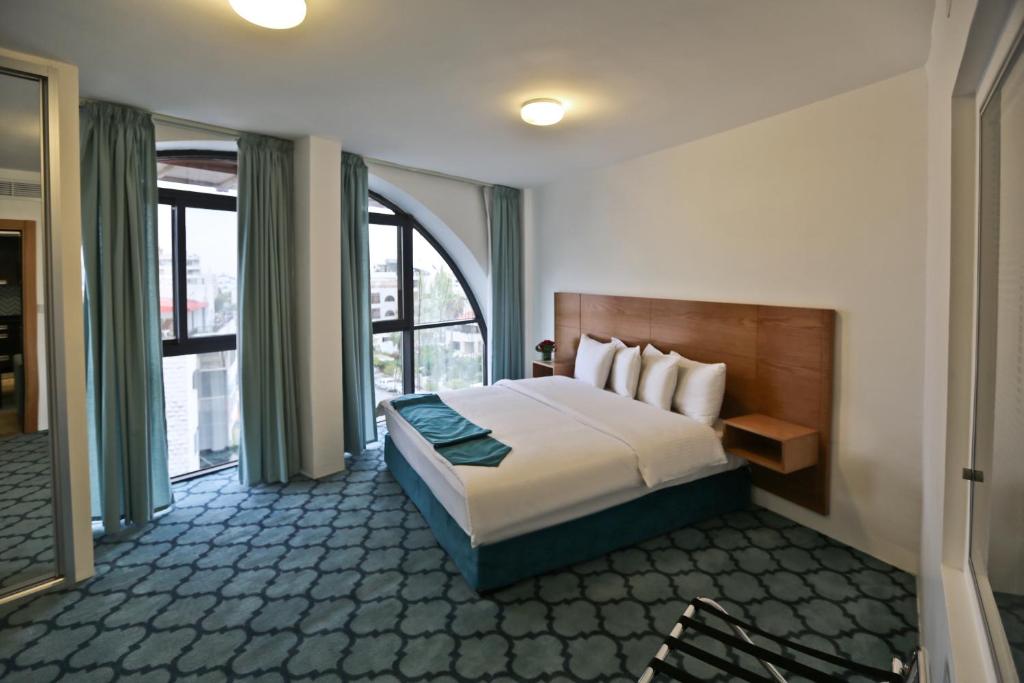 Postel nebo postele na pokoji v ubytování Khuttar Apartment