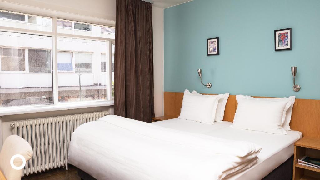 Postel nebo postele na pokoji v ubytování Center Hotels Klopp