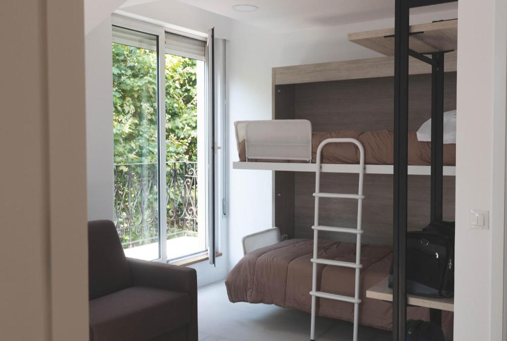 Postel nebo postele na pokoji v ubytování Hostel Villa Miguela