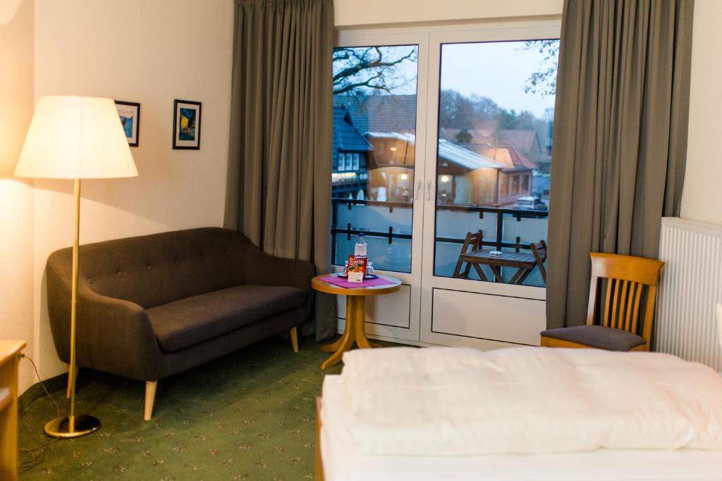 Postel nebo postele na pokoji v ubytování Akzent Hotel Zur Grünen Eiche