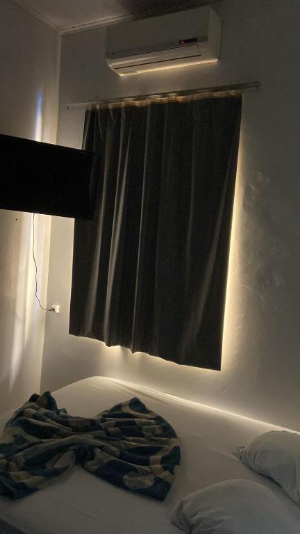 Postel nebo postele na pokoji v ubytování HOTEL REAL