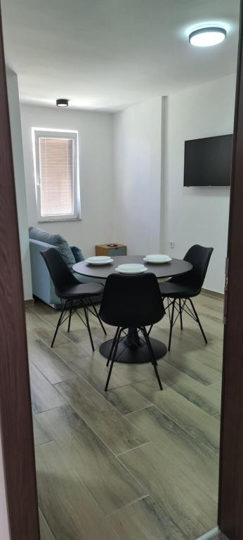 TV a/nebo společenská místnost v ubytování G&G Suites