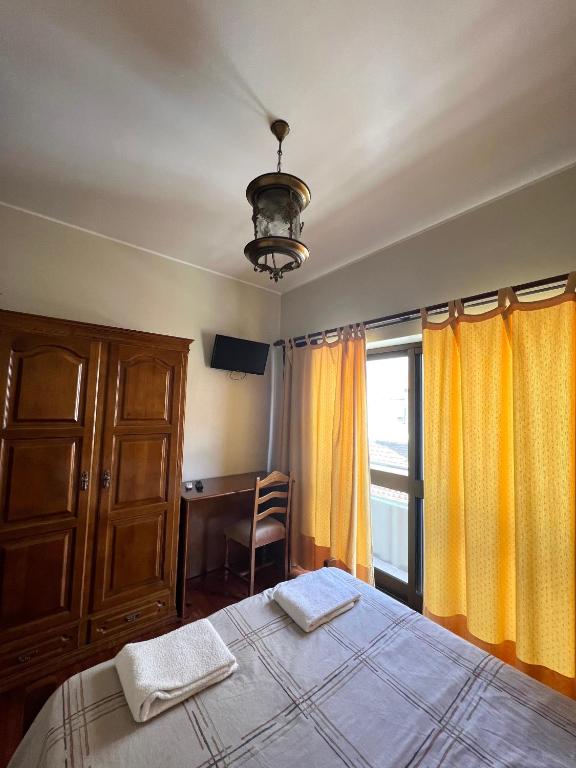 Postel nebo postele na pokoji v ubytování Abrigo do Portinho